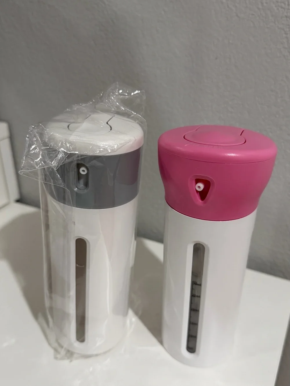 4-in-1 travel dispenser bottles Gray And Pink